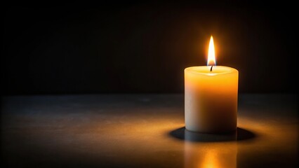 Solitary candle illuminating darkness, evoking loneliness and contemplation