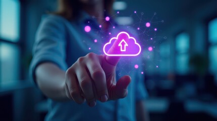 A hand interacts with a glowing digital cloud icon, symbolizing data upload and digital connectivity in a modern technology setting.