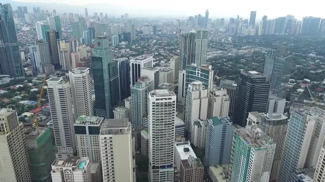 Manila Makati City in Philippines. Cityscape Skyline and Business Skyscrapers in Background. Manila Business District Traffic.