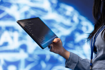 Software developer with tablet programming artificial intelligence computing simulating human...