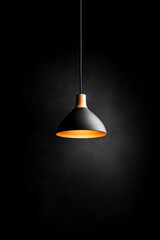 modern pendant light against black background