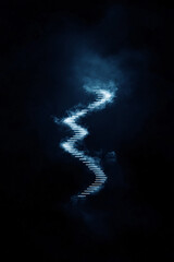 Obraz premium Abstract zigzag light trail in dark blue misty atmosphere