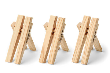 Three wooden clothespins arranged in a row on a white background.