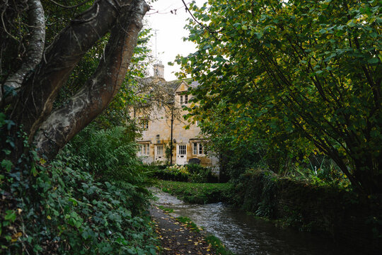 Autumnal English Village with Limestone Cottages and Autumn Trees - Quintessential Filming Location for Father Brown in Blockley, Gloucestershire in The Cotswolds