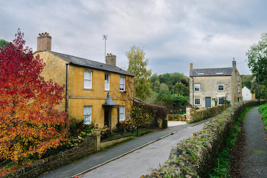 Autumnal English Village with Limestone Cottages and Autumn Trees - Quintessential Filming Location for Father Brown in Blockley, Gloucestershire in The Cotswolds