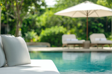 Obraz premium Outdoor pool area with modern furniture, surrounded by garden with plants and trees