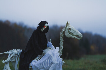 Grim Reaper on a Skeleton Horse  with Glowing Red Eyes: Spooky Halloween Scene.