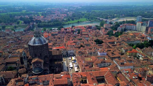 Drone view of the city with the Duomo Santo Stefano and Santa Maria Assunta cathedral in the city center. drone. City of a hundred towers. medieval architecture. University. Pavia Italy 23.04.2025