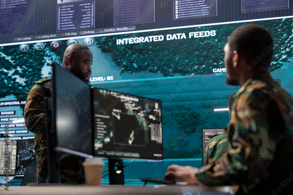 Poster cybersecurity team operates in an advanced military command center, managing surveillance systems an