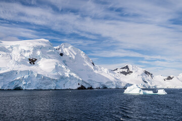 A tranquil Antarctic landscape, near Graham passage along Charlotte Bay, highlighting stark...