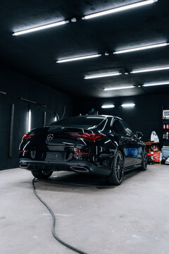 Photo of a Mercedes CLA 2024 in detailing studio. They show details of the car from the outside and inside. The photo is suitable for use in marketing materials, advertisements or press articles.