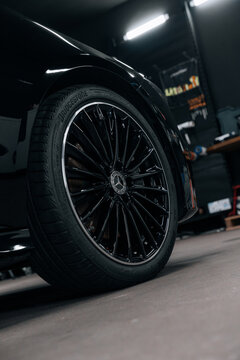 Photo of a Mercedes CLA 2024 in detailing studio. They show details of the car from the outside and inside. The photo is suitable for use in marketing materials, advertisements or press articles.