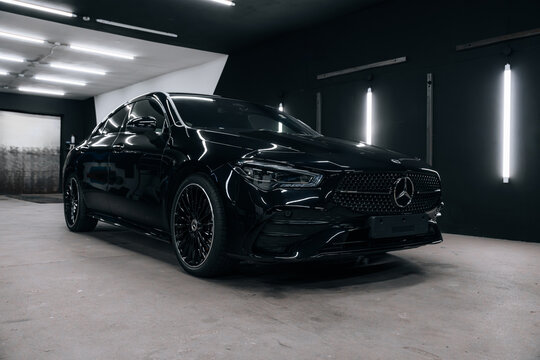 Photo of a Mercedes CLA 2024 in detailing studio. They show details of the car from the outside and inside. The photo is suitable for use in marketing materials, advertisements or press articles.
