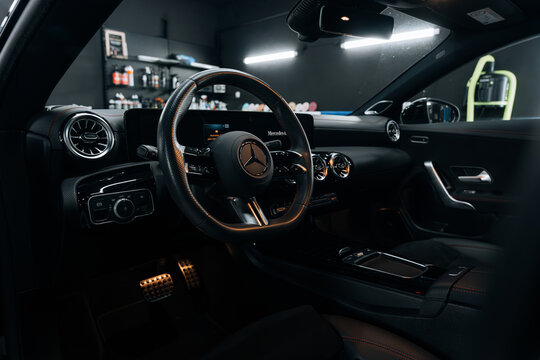 Photo of a Mercedes CLA 2024 in detailing studio. They show details of the car from the outside and inside. The photo is suitable for use in marketing materials, advertisements or press articles.