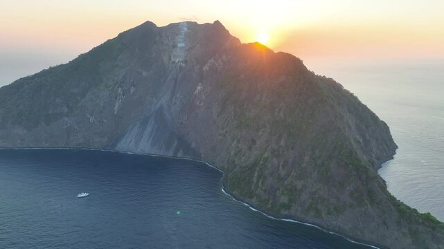 The sun shines on the volcanically active island of Komba lying 70 km north of the island of Lembata in the Lesser Sunda Islands. The reefs surrounding this remote island are rich in fish and corals.