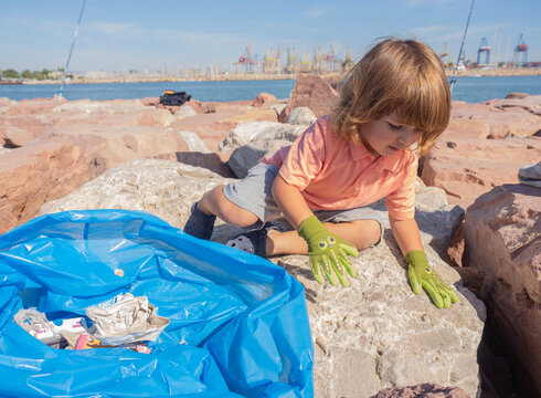 Young child participates in coastal cleanup efforts