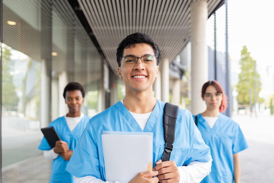 Young nursing students walking outdoors in university campus