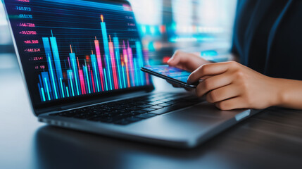 Businesswoman using smartphone and laptop to view innovation reports, digital graphs, analyze market changes and investments during holidays.