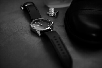 Elegant Sports Watch on Leather Surface with Accessories