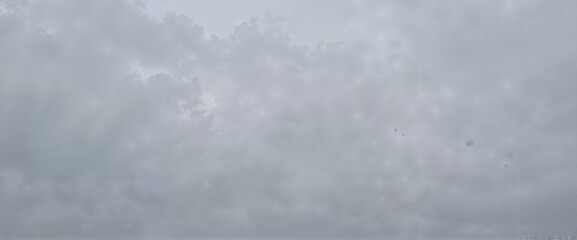 Fototapeta premium Overcast sky with gray clouds and misty atmosphere