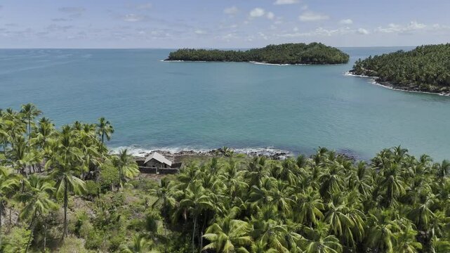 Drone orbits Alfred Dreyfus Prison on Devil's Island at midday in the Salvation Islands, near Kourou, French Guiana, France