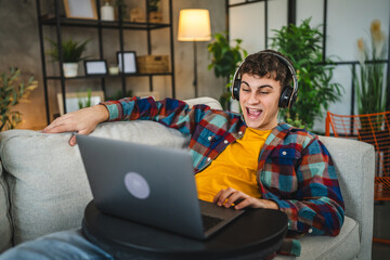 Relax adult man with headphones watch movie on laptop