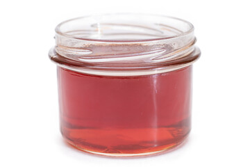 Dark Honey in a Small Glass Jar Isolated on White Background