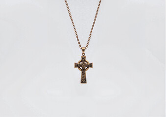 Celtic cross pendant on chain isolated on white background