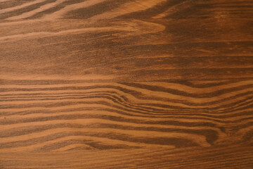 Applying walnut wood stain. Texture of wooden surface as background, top view