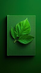 Green book with leaf design on a vibrant green background.