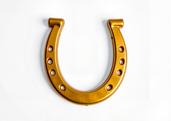 Golden horseshoe isolated on white background