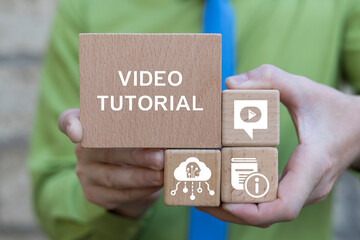User holding wooden blocks sees inscription: ONLINE LIBRARY. E-learning education concept. Online...