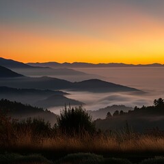 Serene sunrise over a misty mountain range