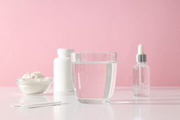 Collagen powder with a glass of water