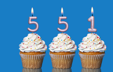 Birthday Cupcakes With Candles Lit Forming The Number 551