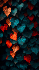 Fototapeta premium A wall of lush green and vibrant red leaves.