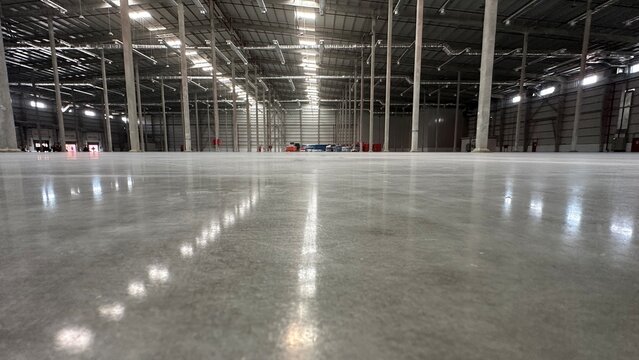 Industrial building or modern factory for manufacturing production plant or large warehouse, Polished concrete floor clean condition and space for industry product display or industry background.