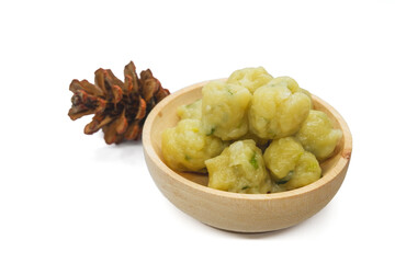 Homemade siomay with soft and chewy texture served in wooden bowl isolated on white background.