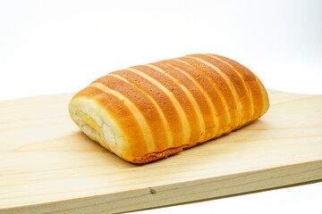 Bread rolls on a cutting board isolated on a white background