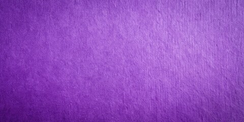 Fototapeta premium A close-up of a textured purple surface with a subtle gradient effect, showcasing the delicate fibers and fine grain of the material.
