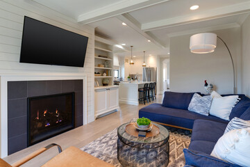 A cozy traditional cottage living room blends charm and modern design, featuring plush sectional, vintage accents, and abundant light. Located in Carlton, Oregon.