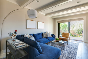 A cozy traditional cottage living room blends charm and modern design, featuring plush sectional, vintage accents, and abundant natural light. Located in Carlton, Oregon.