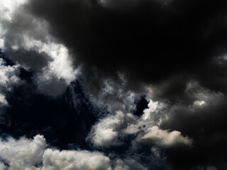 Fototapeta premium Cloud storm sky dark halloween background rain lightning thunder stoumy typhoon Nature light scene rainy atmosphere damage effect carbon dioxide dust air pollution 2.5 Pm, texture nature windstorm.