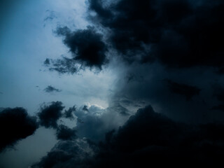 Fototapeta premium Cloud storm sky dark halloween background rain lightning thunder stoumy typhoon Nature light scene rainy atmosphere damage effect carbon dioxide dust air pollution 2.5 Pm, texture nature windstorm.