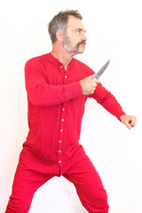 Man With Old Style Red Long Underwear Holding A Knife