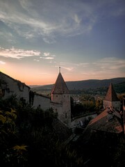 Fototapeta premium Majestic Castle with Towers Bathed in Sunset Glow