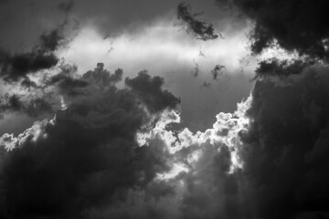 Dark clouds gather, creating a powerful and ominous scene with dramatic contrast
