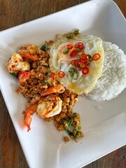 Rice topped with stir-fried pork and basil, Rice topped with stir fried minced pork and basil with Fried egg