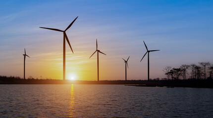 wind turbine at colorful sunrise. Ecological energy concept