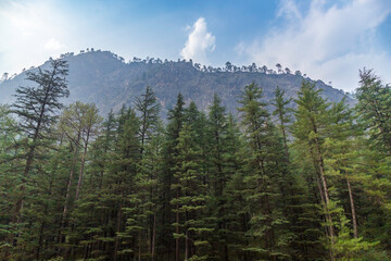 Landscape with mountains and clouds. Sunset over the mountains. Beautiful, serene camping site view of Himalayan snowscapes mountains, Kasol, Parvati valley, Himachal Pradesh,
